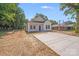 Beautifully landscaped property with a well-maintained lawn, driveway, and charming white home at 1407 7Th St # 4, Statesville, NC 28677