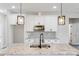 Close up on kitchen island with granite countertop, black fixtures, and pendant lights at 1407 7Th St # 4, Statesville, NC 28677