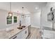 Kitchen featuring an island with granite counters and stainless steel dishwasher at 1407 7Th St # 4, Statesville, NC 28677
