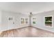 Inviting living room with hardwood floors, bright windows, and a stylish ceiling fan at 1407 7Th St # 4, Statesville, NC 28677