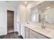 Bathroom with dual sinks, a large mirror, and a glass-enclosed shower at 146 Astor St, Troutman, NC 28166