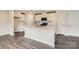 Modern kitchen featuring white cabinets, stainless steel appliances, island, and a subway tile backsplash at 146 Astor St, Troutman, NC 28166