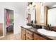 Bathroom with double sinks and wood cabinets at 1530 Danlee Dr, Lancaster, SC 29720