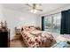 Bright bedroom with a floral-patterned bedspread, a ceiling fan, and natural light at 1530 Danlee Dr, Lancaster, SC 29720