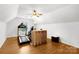 Bonus room featuring a treadmill, television and hardwood flooring at 1530 Danlee Dr, Lancaster, SC 29720