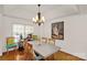 Bright dining room featuring hardwood floors and a stylish chandelier, perfect for gatherings at 1530 Danlee Dr, Lancaster, SC 29720