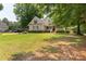 Charming traditional-style home with a well-manicured lawn and a inviting front porch at 1530 Danlee Dr, Lancaster, SC 29720