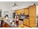 Well-equipped kitchen featuring oak cabinetry and stainless-steel appliances on hardwood floor at 1530 Danlee Dr, Lancaster, SC 29720