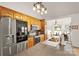 Well-lit kitchen featuring stainless steel appliances, light wood cabinets, and an adjacent breakfast nook at 1530 Danlee Dr, Lancaster, SC 29720