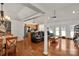 Open-concept living space with hardwood floors, a column, and modern seating options for comfortable living at 1530 Danlee Dr, Lancaster, SC 29720