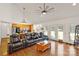 Comfortable living room with hardwood floors, vaulted ceilings, and stylish leather reclining sofa at 1530 Danlee Dr, Lancaster, SC 29720