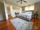 Bedroom displays hardwood floors, ceiling fan, and great natural light at 156 Spruce St, Badin, NC 28009