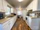 Functional kitchen featuring white cabinetry, modern appliances, and ample counter space, perfect for everyday meal preparation at 156 Spruce St, Badin, NC 28009