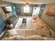 Inviting living room with a stone fireplace, plush sectional sofa, and modern decor for a comfortable living space at 156 Spruce St, Badin, NC 28009