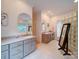 Spacious bathroom with double vanities, modern fixtures, and natural light at 15708 Eagleview Dr, Charlotte, NC 28278