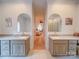 Bathroom with dual vanities, framed mirrors, and decorative finishes at 15708 Eagleview Dr, Charlotte, NC 28278