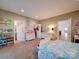 Spacious bedroom with connected bathroom and closet, decorated with colorful accents at 15708 Eagleview Dr, Charlotte, NC 28278