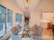 Bright dining room features large windows and a modern chandelier at 15708 Eagleview Dr, Charlotte, NC 28278