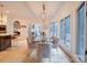Beautiful dining room features a glass table, velvet chairs, and bright natural lighting at 15708 Eagleview Dr, Charlotte, NC 28278