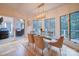 Open dining room shows outdoor access, bright windows, and modern furnishing at 15708 Eagleview Dr, Charlotte, NC 28278