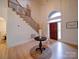 Inviting foyer features gleaming hardwood floors, elegant staircase, and a striking arched entry at 15708 Eagleview Dr, Charlotte, NC 28278