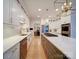 Spacious kitchen features an island with range, stainless appliances, and white cabinetry at 15708 Eagleview Dr, Charlotte, NC 28278