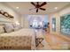 Open layout main bedroom boasts sitting area, natural light, and ceiling fan at 15708 Eagleview Dr, Charlotte, NC 28278