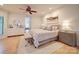 Spacious bedroom featuring hardwood floors, large bed, and neutral color scheme at 15708 Eagleview Dr, Charlotte, NC 28278
