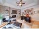 Executive office showcases fireplace with brick accent wall and built-in shelving at 15708 Eagleview Dr, Charlotte, NC 28278