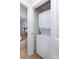 Laundry closet with a stacked washer and dryer unit at 15907 Rose Glenn Ln, Davidson, NC 28036