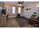 Comfortable living room with a sectional sofa, a patterned rug, and plenty of natural light at 15907 Rose Glenn Ln, Davidson, NC 28036