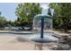 Fun community splash pad with fountain and seating, perfect for hot summer days at 15907 Rose Glenn Ln, Davidson, NC 28036