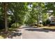This is a picturesque street view lined with lush trees, offering a tranquil and inviting neighborhood setting at 15907 Rose Glenn Ln, Davidson, NC 28036