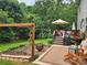 Outdoor space featuring a deck, patio, garden, and seating areas, perfect for relaxation and entertaining at 167 Foxtail Dr, Mooresville, NC 28117