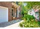 Charming brick home featuring a welcoming front porch with beautiful landscaping and a 'Welcome' sign at 167 Foxtail Dr, Mooresville, NC 28117
