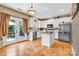 Bright kitchen with granite counters, island, and stainless steel appliances at 167 Foxtail Dr, Mooresville, NC 28117