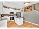 Well-equipped kitchen with white cabinets, granite counters, and stainless appliances at 167 Foxtail Dr, Mooresville, NC 28117