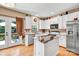 Bright kitchen with white cabinets, granite counters, and stainless appliances at 167 Foxtail Dr, Mooresville, NC 28117