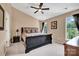 Cozy main bedroom with plush carpeting, ceiling fan, and natural light at 167 Foxtail Dr, Mooresville, NC 28117