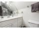 Clean bathroom with a vanity sink, shower, and a mirror at 1701 Truman Rd, Charlotte, NC 28205