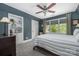 Cozy bedroom with a large window, built-in bookshelf and carpet floors at 1701 Truman Rd, Charlotte, NC 28205