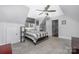 Bedroom with a ceiling fan and a large window providing ample natural light at 1701 Truman Rd, Charlotte, NC 28205