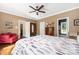 Bedroom with hardwood floors, ceiling fan, natural light, and neutral color scheme at 1701 Truman Rd, Charlotte, NC 28205