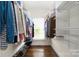 Walk-in closet with organized shelving, storage, hardwood floors and ample storage space at 1701 Truman Rd, Charlotte, NC 28205