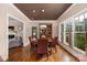 Dining room with hardwood floors, natural light, and views of the living room at 1701 Truman Rd, Charlotte, NC 28205