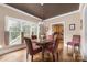 Dining room with hardwood floors, natural light, and views of the kitchen at 1701 Truman Rd, Charlotte, NC 28205