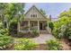 Charming home featuring a cozy front porch, a landscaped yard, and a welcoming entrance at 1701 Truman Rd, Charlotte, NC 28205