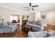 Bright living room showcasing hardwood floors and neutral colors, with a view into the dining room at 1701 Truman Rd, Charlotte, NC 28205