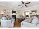 Inviting living room boasting a fireplace, hardwood floors, and an open layout to the dining area at 1701 Truman Rd, Charlotte, NC 28205