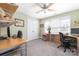 Green office with carpet, two desks, and a window providing natural light at 1701 Truman Rd, Charlotte, NC 28205